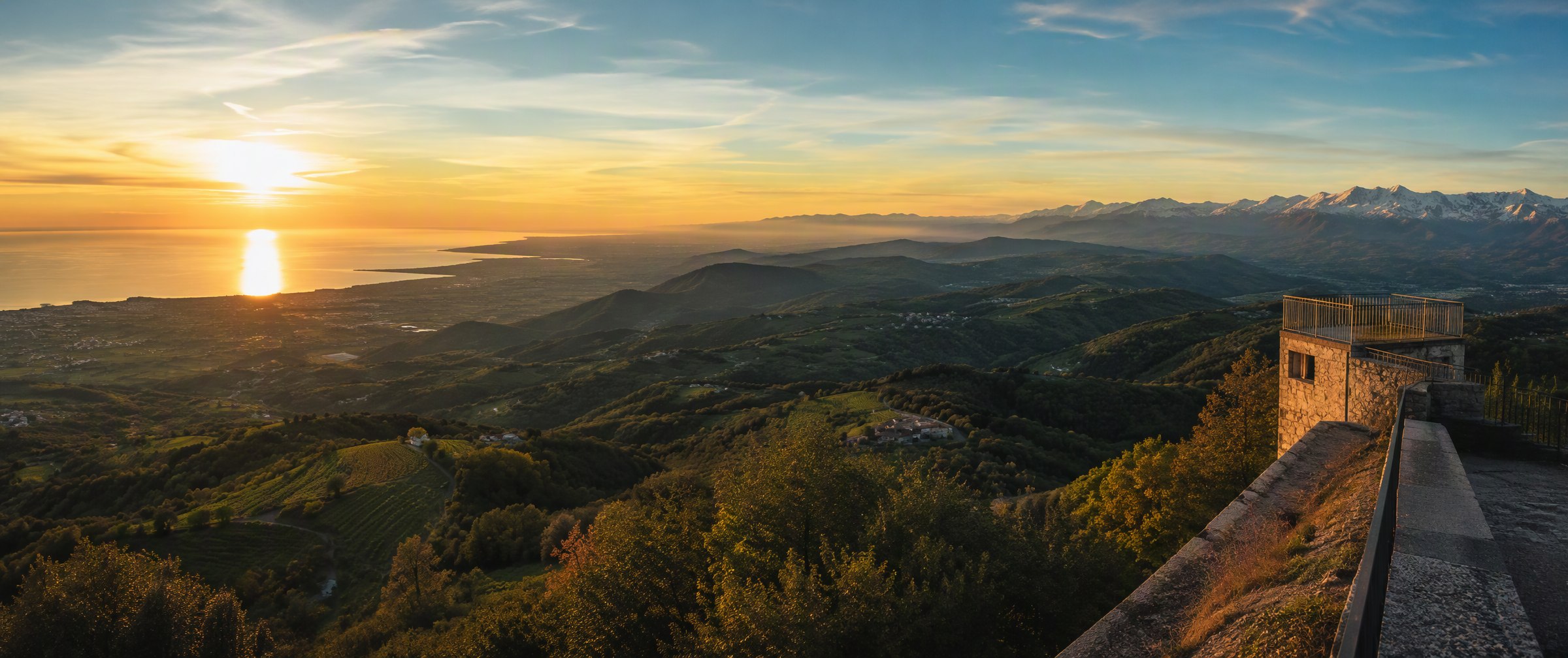 Panorama from Gonjače tower — vine hills rolling toward the Alps and the Adriatic