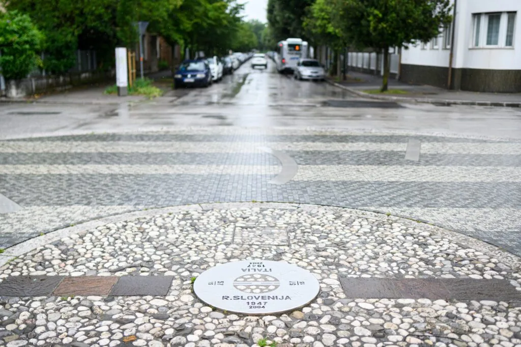 Border marker between Slovenia and Italy set into the pavement in the Nova Gorica–Gorizia conurbation
