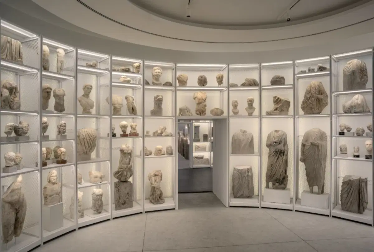 The museum's circular sculpture gallery displaying Roman busts and statues in illuminated glass cases