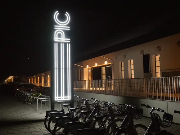 The illuminated EPIC sign outside the centre at night