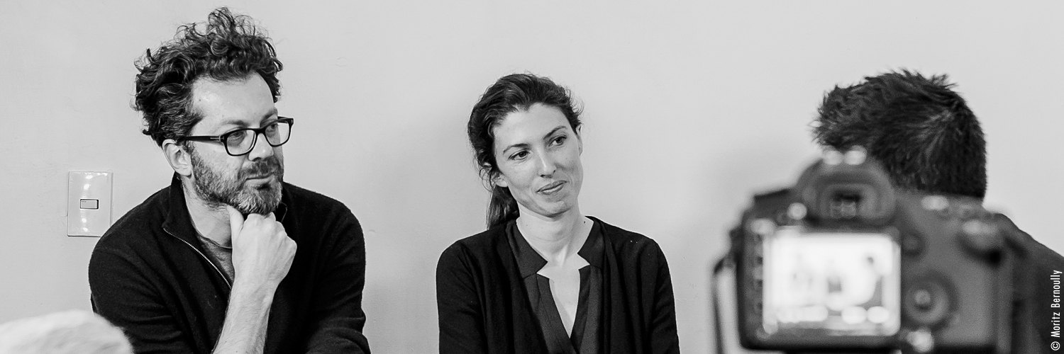 Ila Bêka and Louise Lemoine during an interview, black and white
