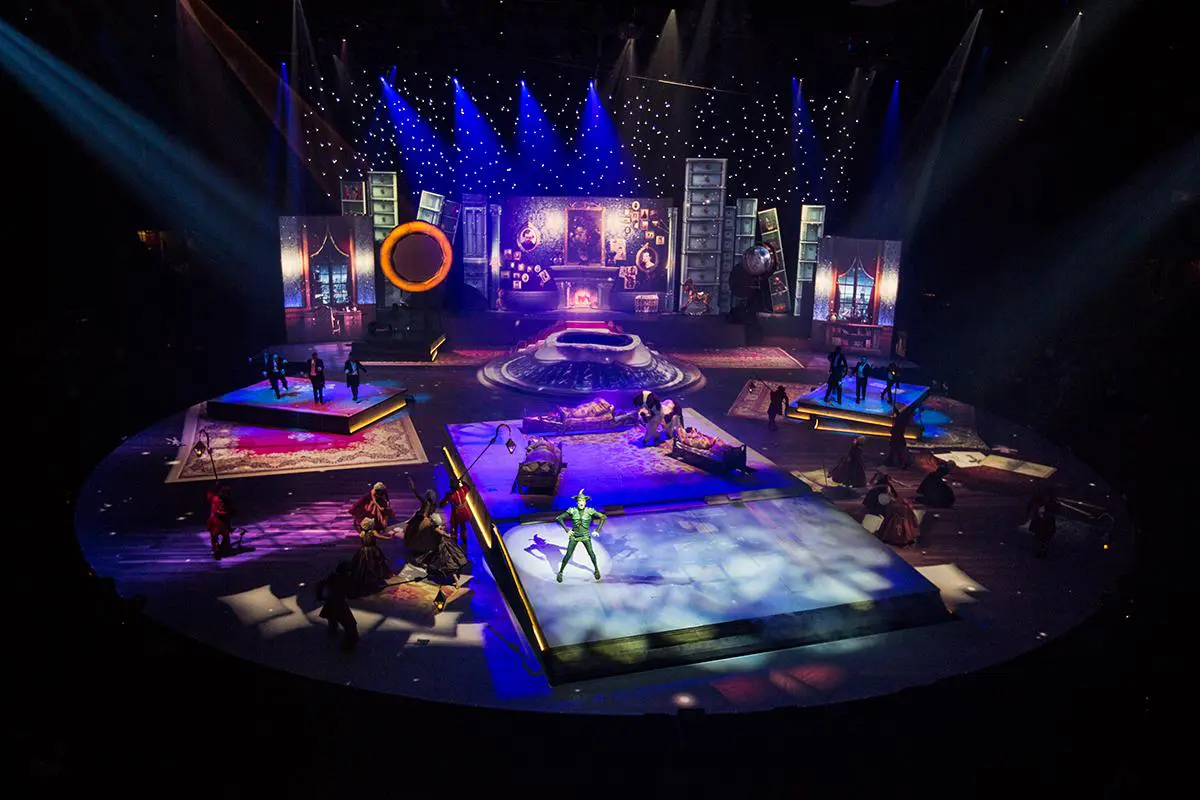 A theatrical stage featuring projection mapping and digital visual effects