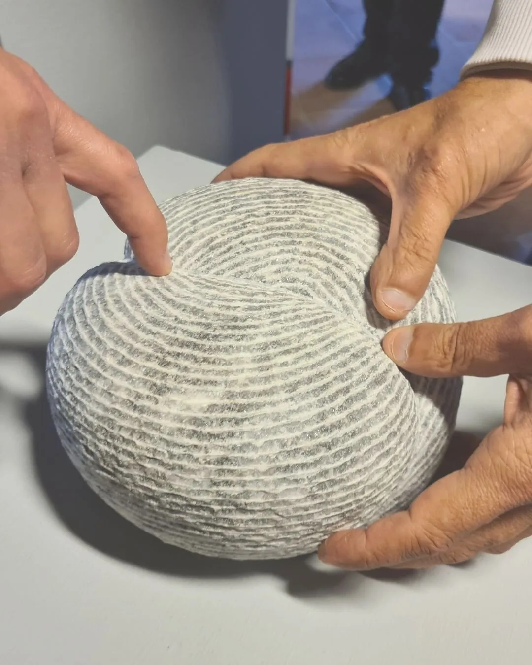 Close-up of tactile stone sphere artwork