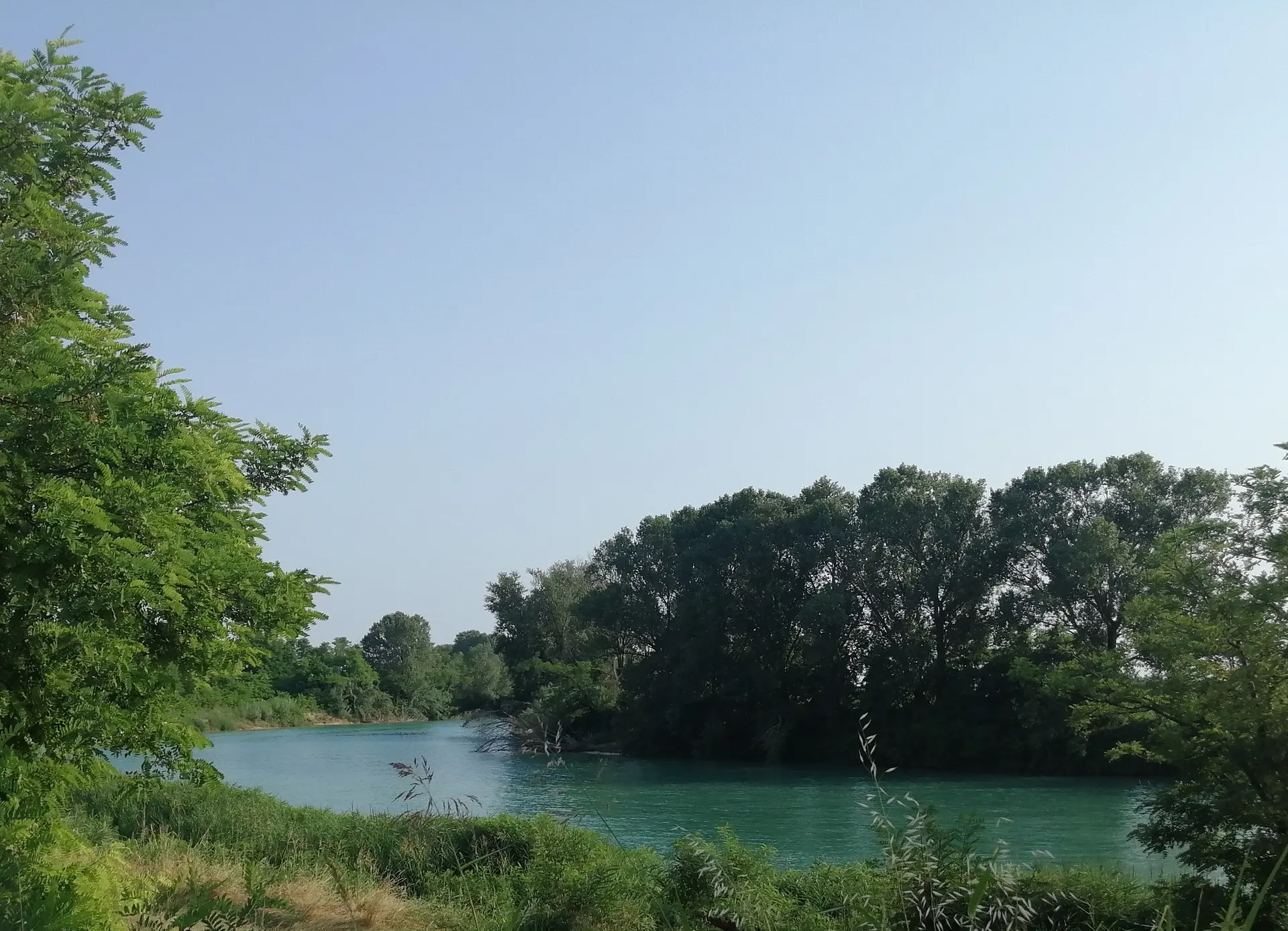 The Cormor River with its characteristic emerald-green waters surrounded by lush vegetation