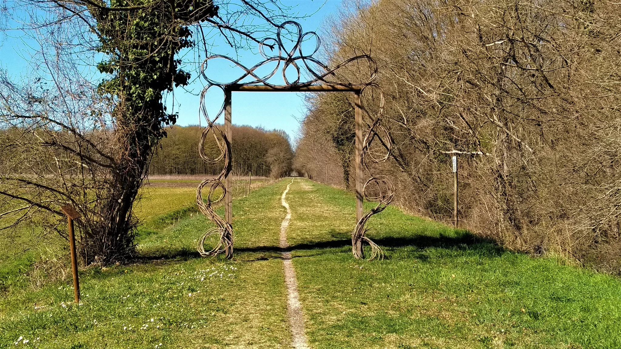 An artistic gate marking the entrance to a cycling trail