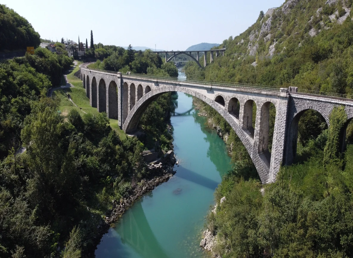The historic Solkan Bridge over the emerald Soča River