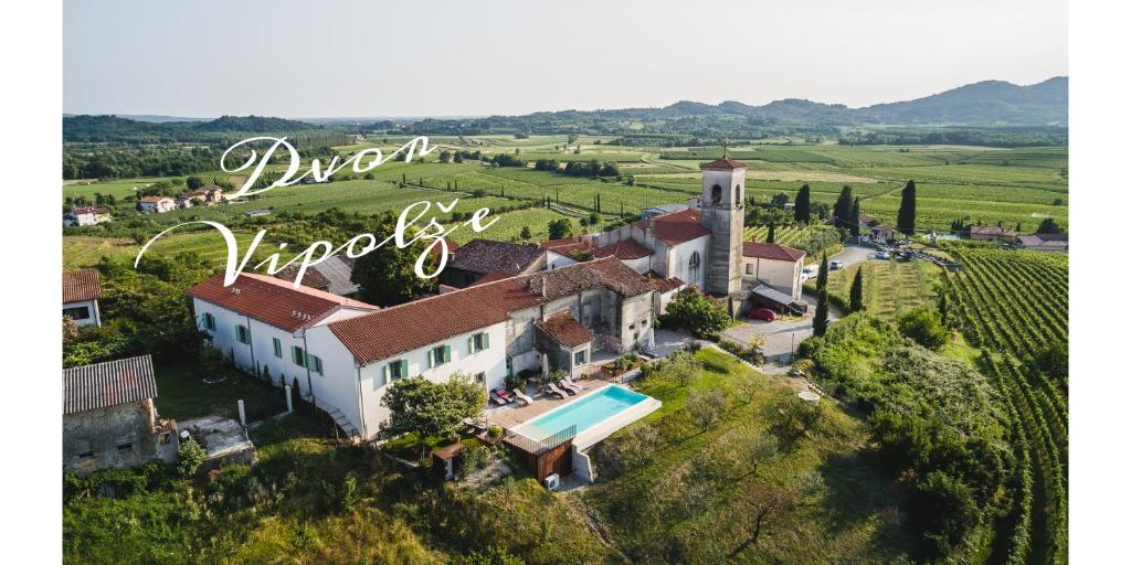 Aerial view of Dvor Vipolže with its infinity pool surrounded by vineyards.