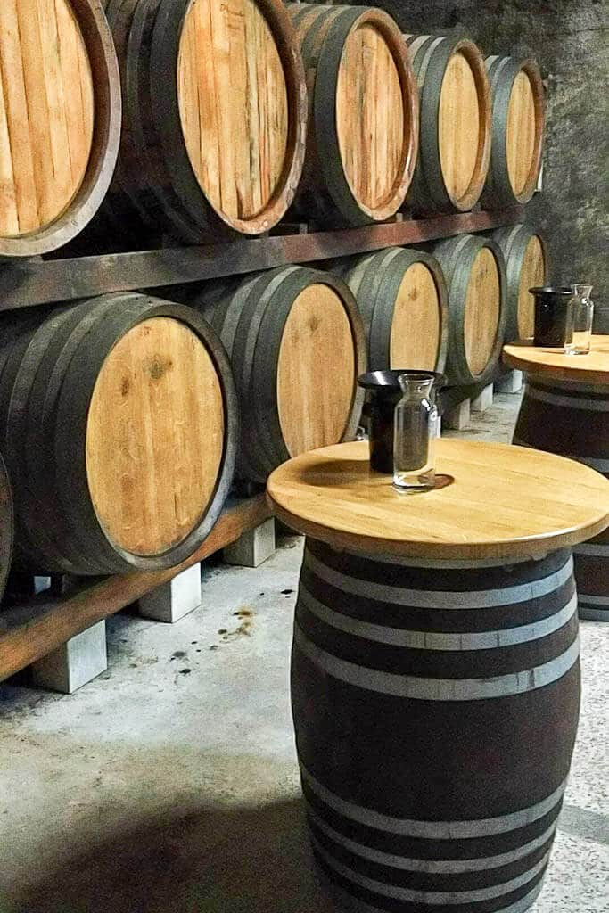 A traditional wine cellar in Brda, where oak barrels line the walls.